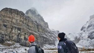 Two men with backpacks hiking up Sentinel Pass in Banff after taking a non-rev flight into YYC (Calgary, Alberta)