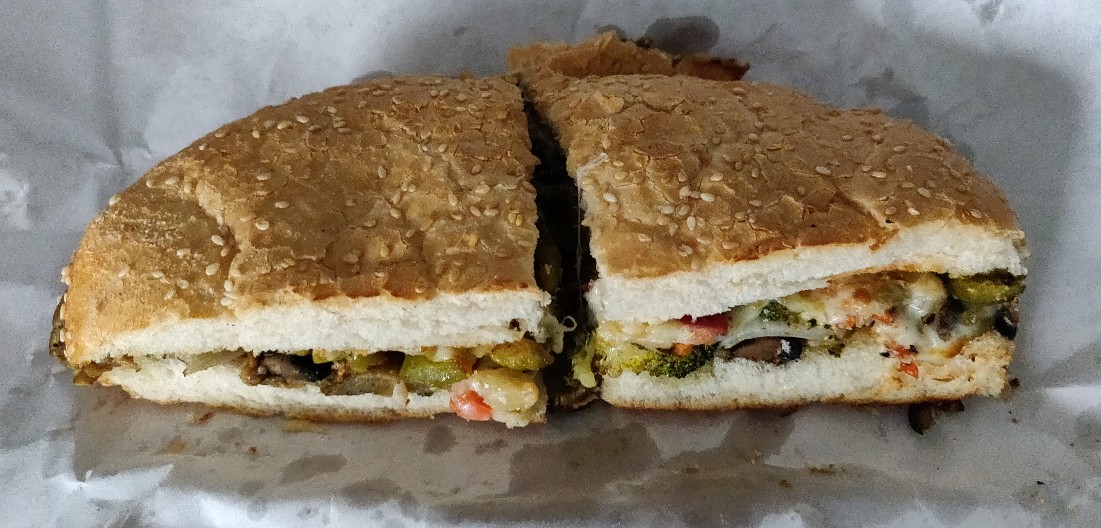 unwrapped 1/2 size vegetarian muffuletta from Lassalle's New Orleans Deli