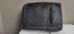 eBags Pro Slim Weekender travel backpack front view of black bag leaning on side