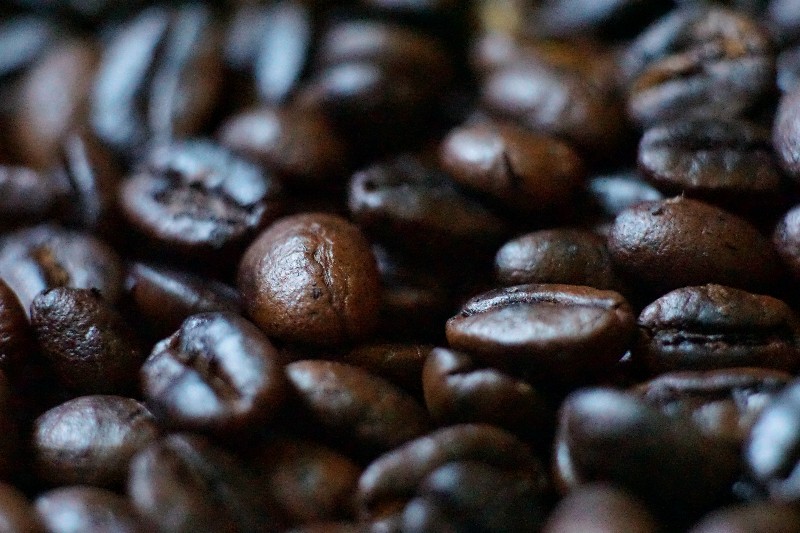 macro shot of medium-dark roast coffee beans