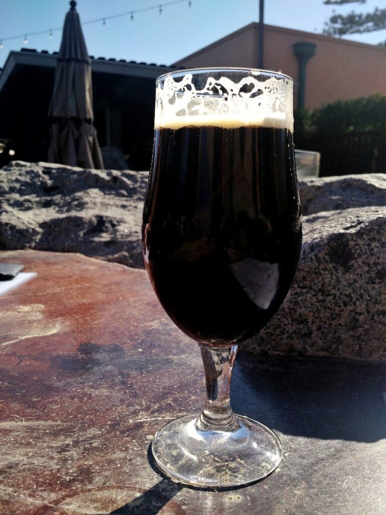 glass of dark beer at Stone's Liberty Station outdoor beer garden