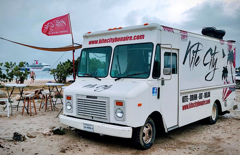 Kite City food truck at Te Amo Beach in Bonaire. Cruise ship in distant background