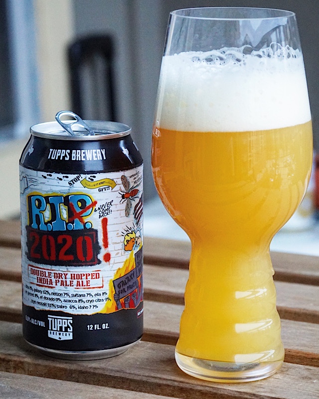 Close up pic of a RIP 2020 can next to a beer glass