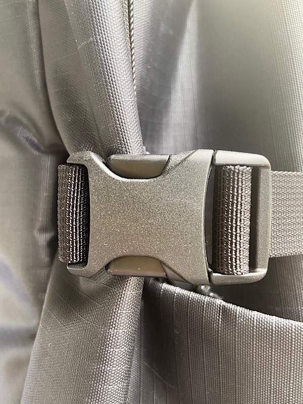 black plastic buckles on the backpack's compression straps