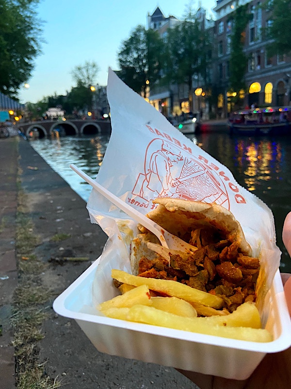 doner kebab & fries with Amsterdam in background
