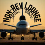 head-on picture of a 3-engine airplane with the text "non-rev lounge travel podcast" as the title