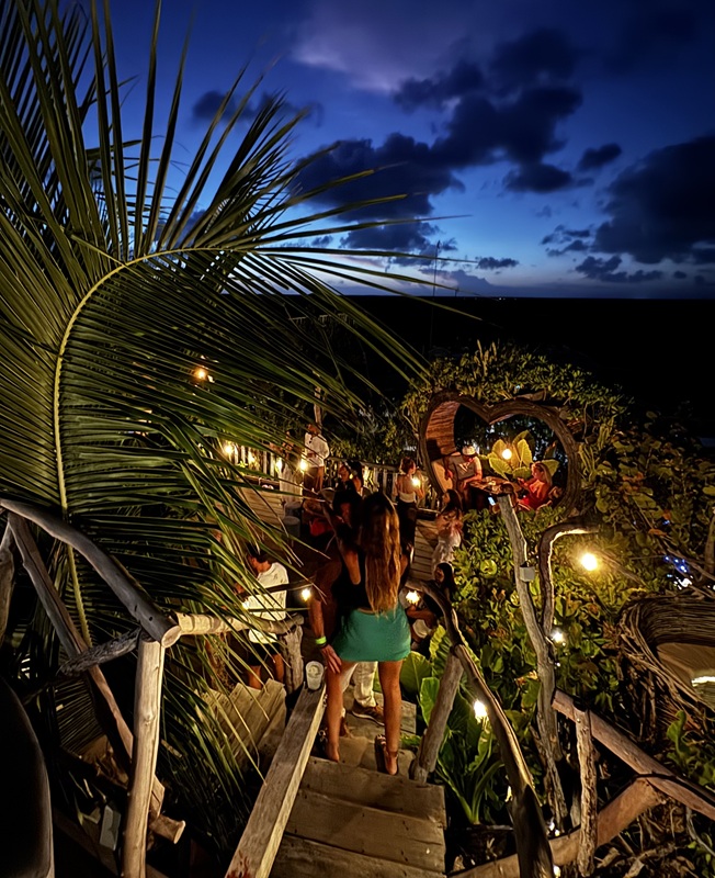 partygoers at a sunset rooftop session in Tulum
